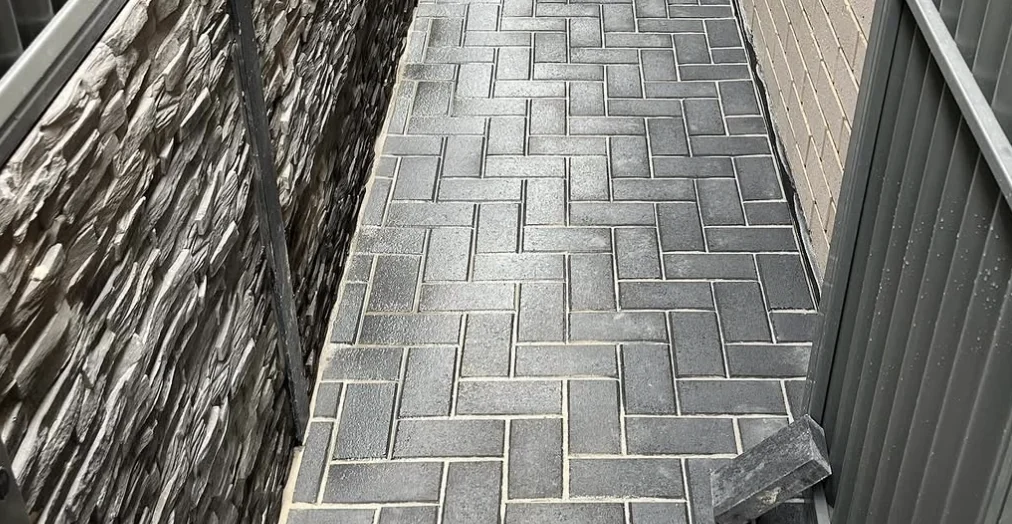Paved side access beside a home