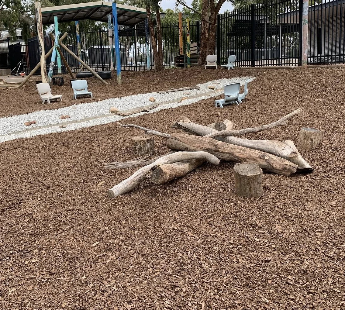 Completed nature play area with timber, rock, gravel and mulch